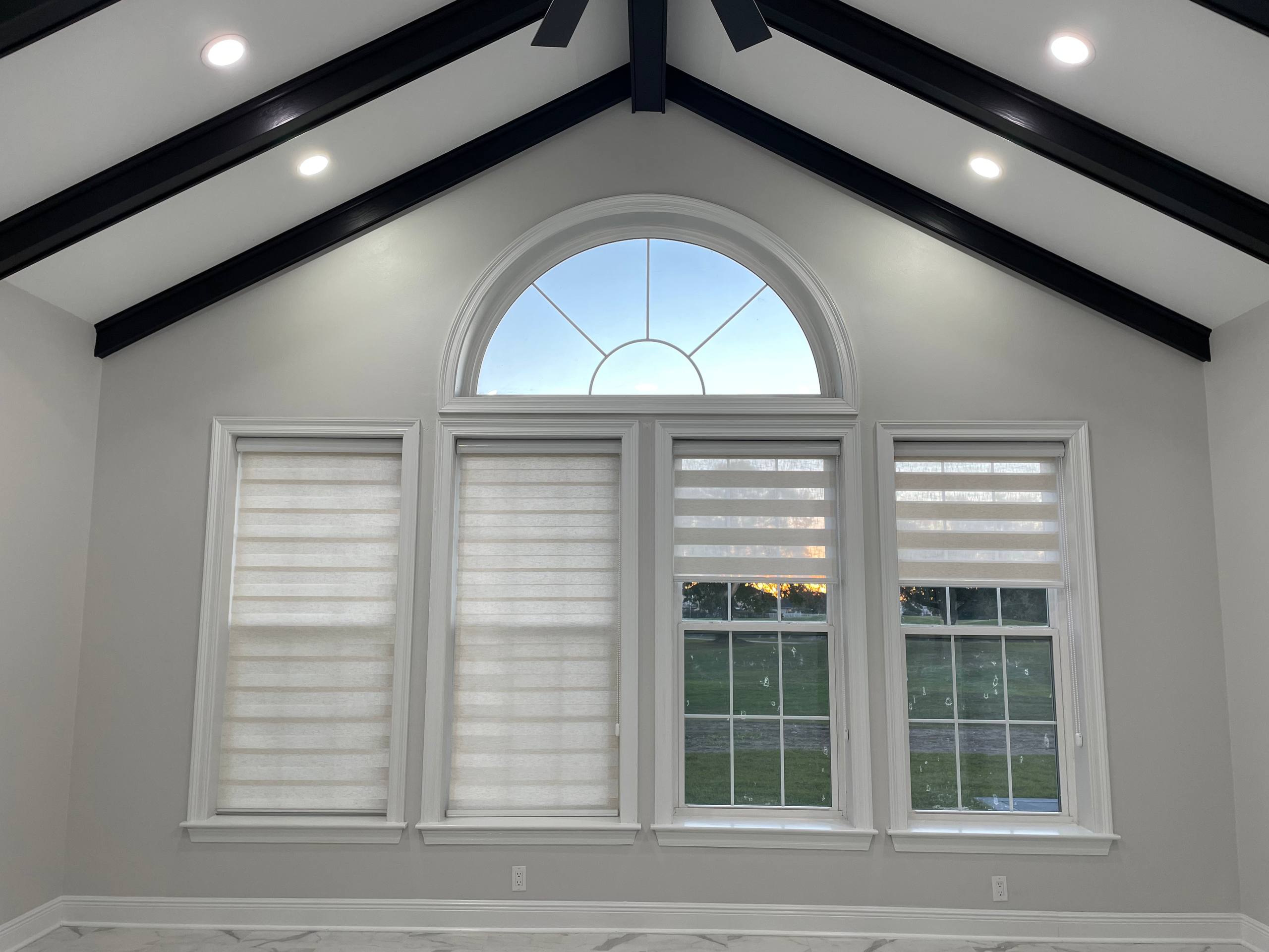 Luxurious bedroom with custom window treatments and coordinated bedding