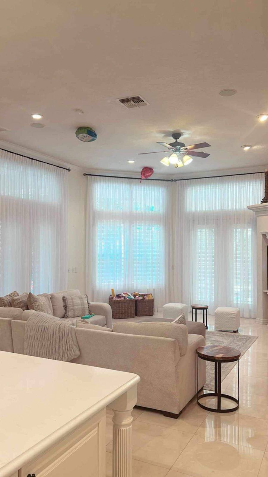 Contemporary living space with minimalist window treatments
