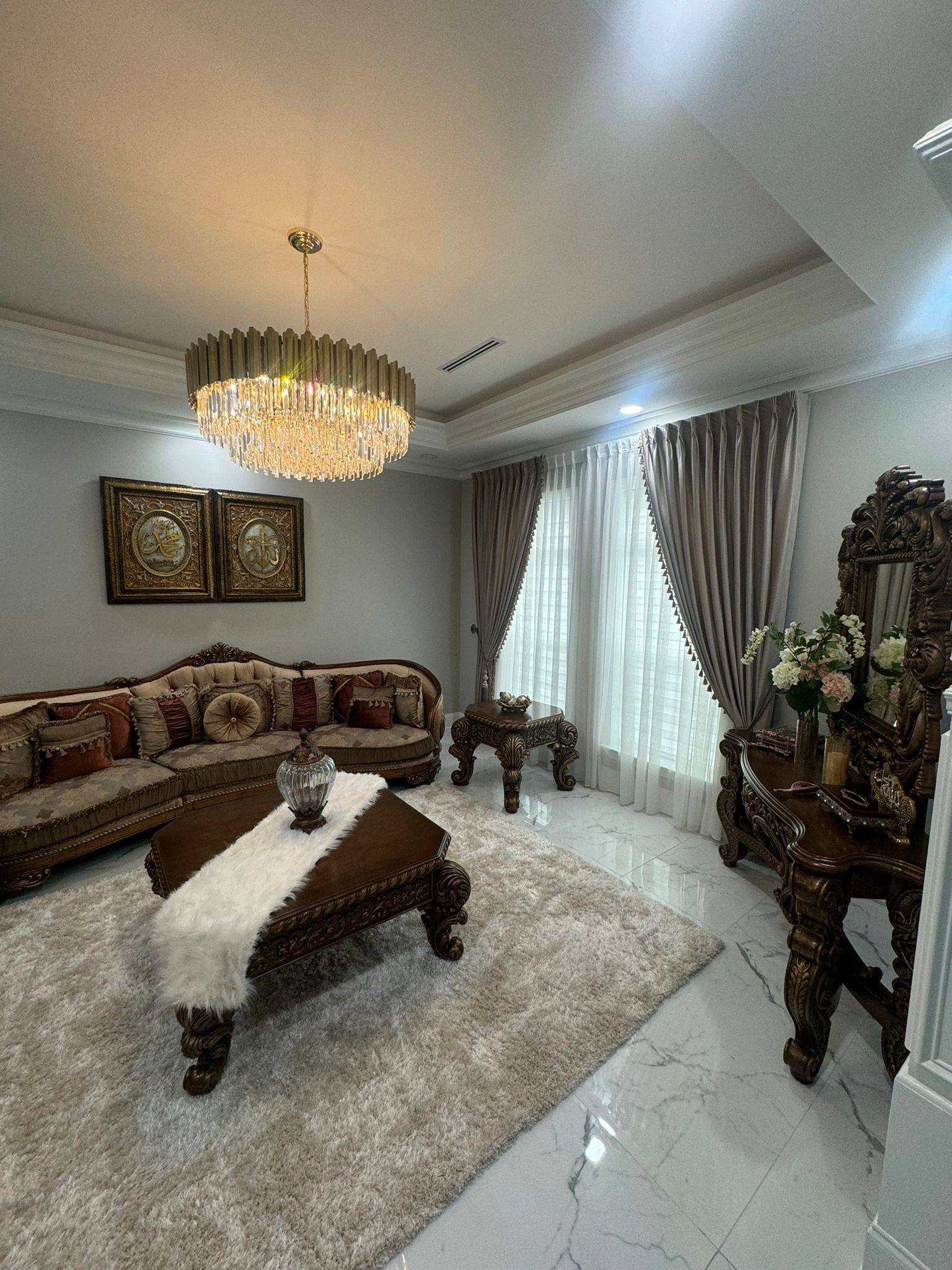 Luxurious velvet curtains in champagne gold with ornate drapery hardware