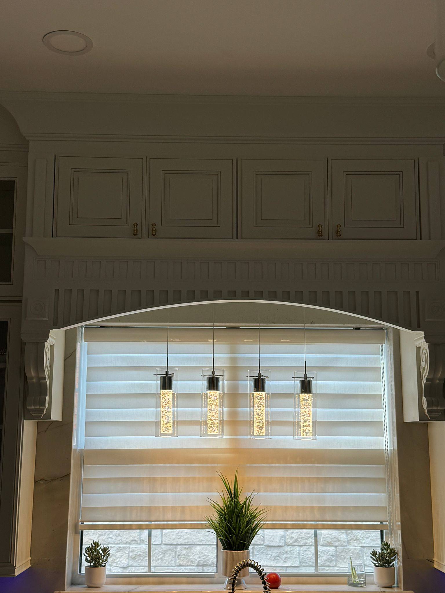 Sheer ivory panel curtains with delicate embroidery in sunlit bedroom