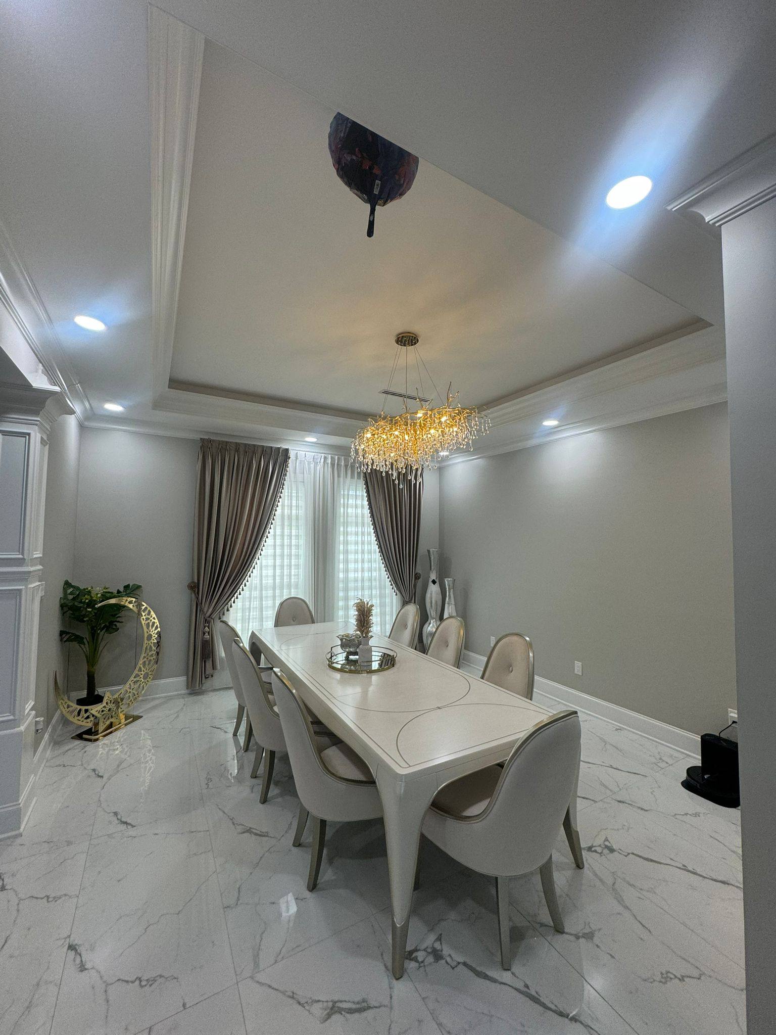 Classic swag and jabot window treatment in rich cream damask fabric