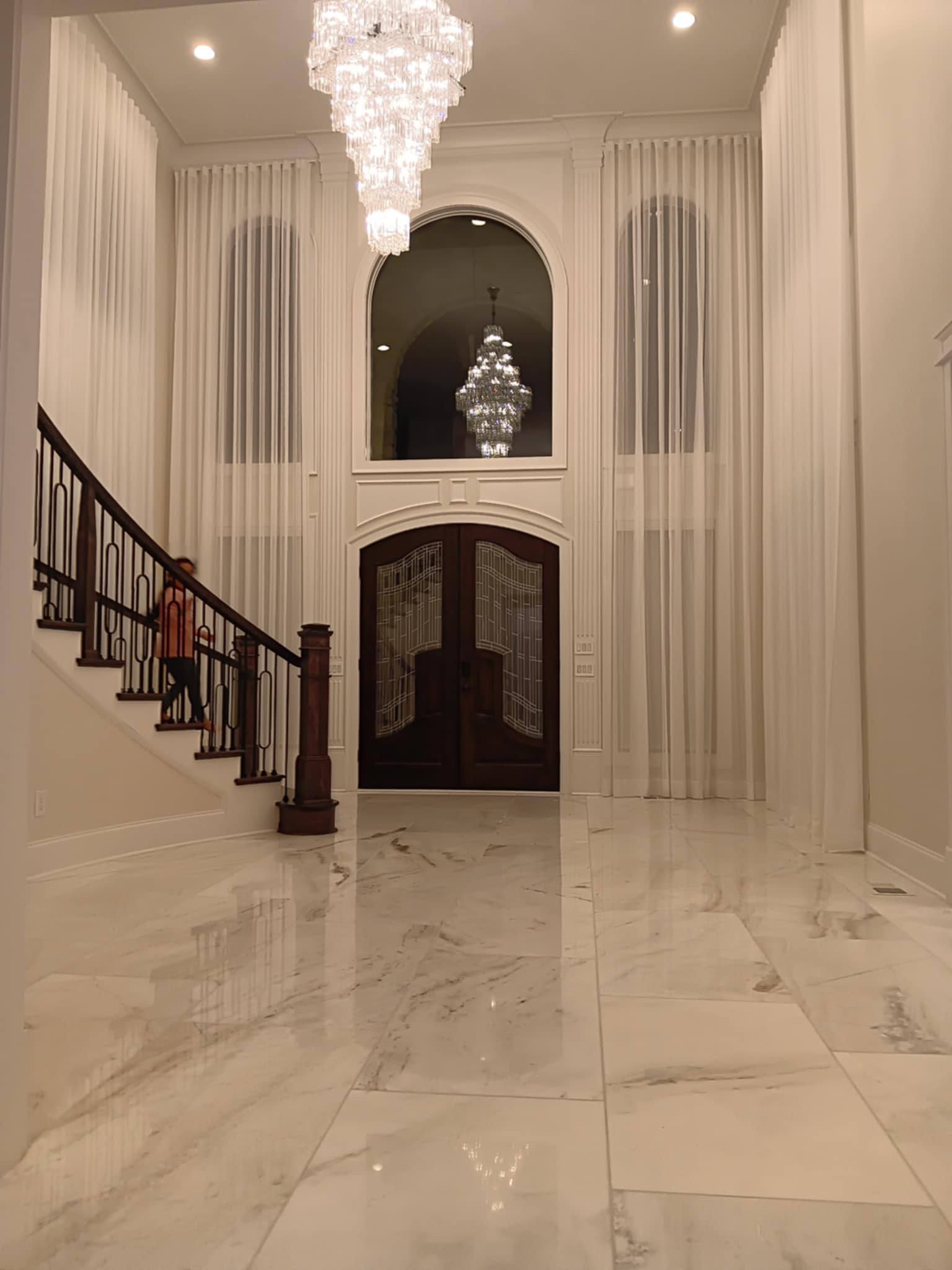 Ornate cornice board with pleated drapes and decorative tassel trim